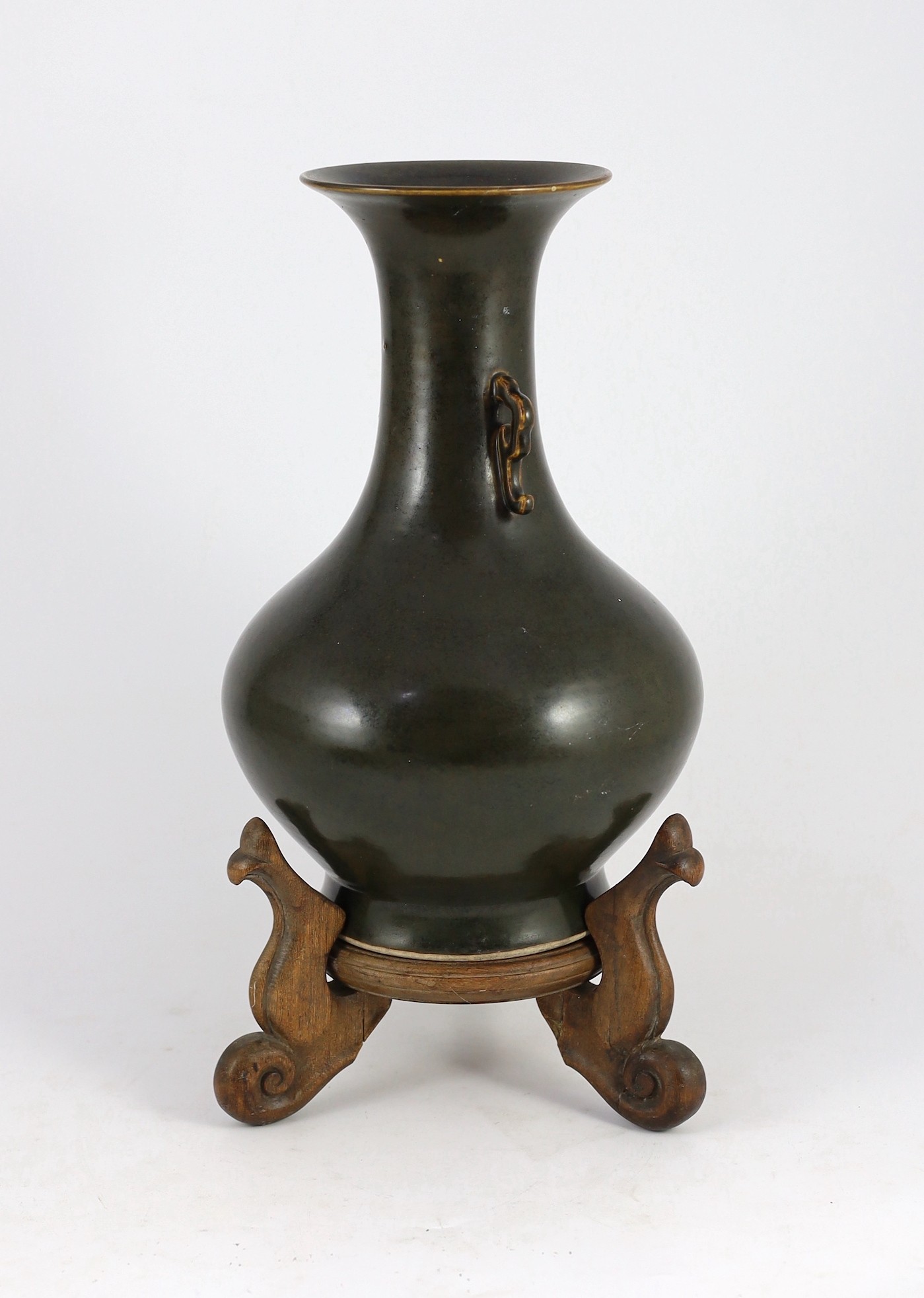 A Chinese Jian style brown glazed vase, hu, 18th/19th century, 31.5cm high, cracked, wood stand